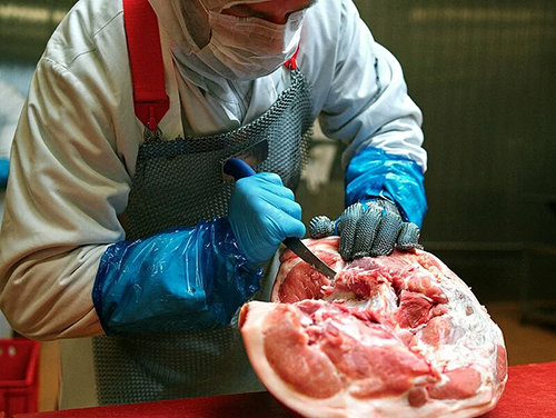 Professional butcher working with an FDick Ergogrip knife