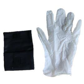 A gloved hand holding a black pouch.