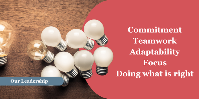 A cluster of white light bulbs with one clear bulb. To the left a larger clear bulb is lit. A blue banner near the bottom of the photo with the words “Our Leadership.” To the right on a red background, the words “Commitment, Teamwork, Adaptability, Focus, Doing what is right.